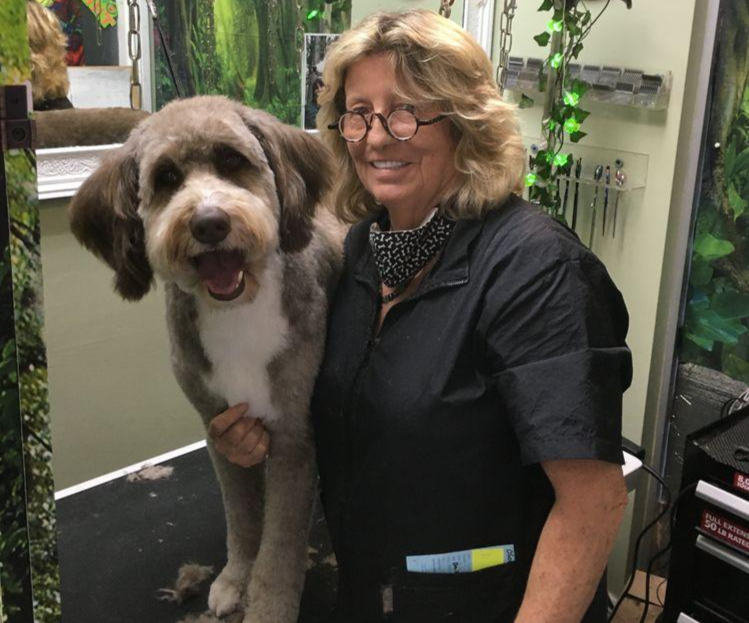 Donna (Madonna Borysewicz), owner of Donna's Doggy Dooz, with a freshly groomed dog at her Wellington, FL salon